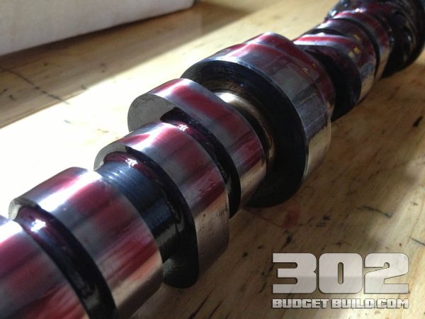 Ford racing camshaft E303. Closeup of cam lobes with assembly lube