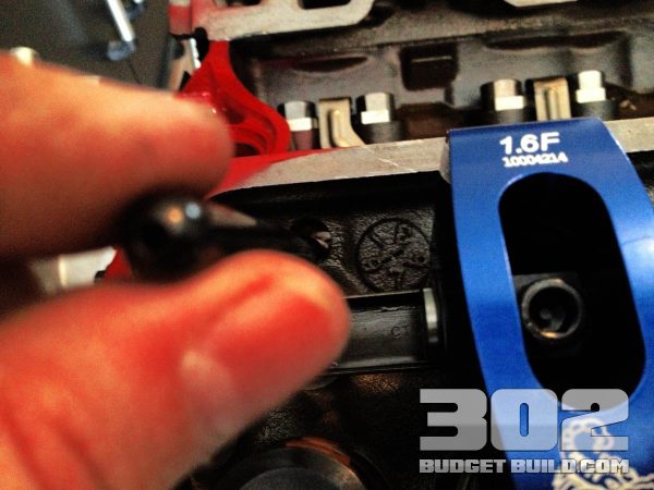 Install a pushrod at base circle of the lifter position on camshaft.